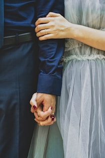 man and woman holding hands