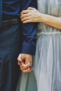 man and woman holding hands