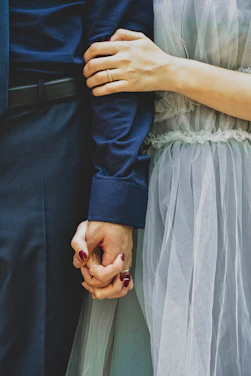 man and woman holding hands