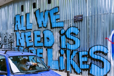 vehicle beside wall with graffiti thought-provoking zoom background