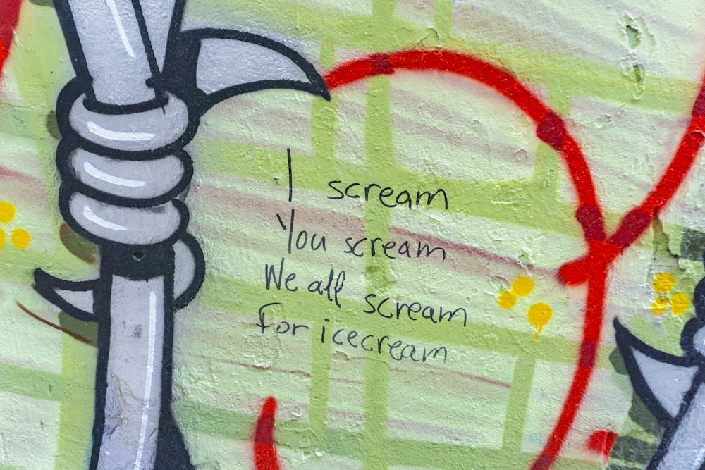 graffiti on a wall with a message written on it