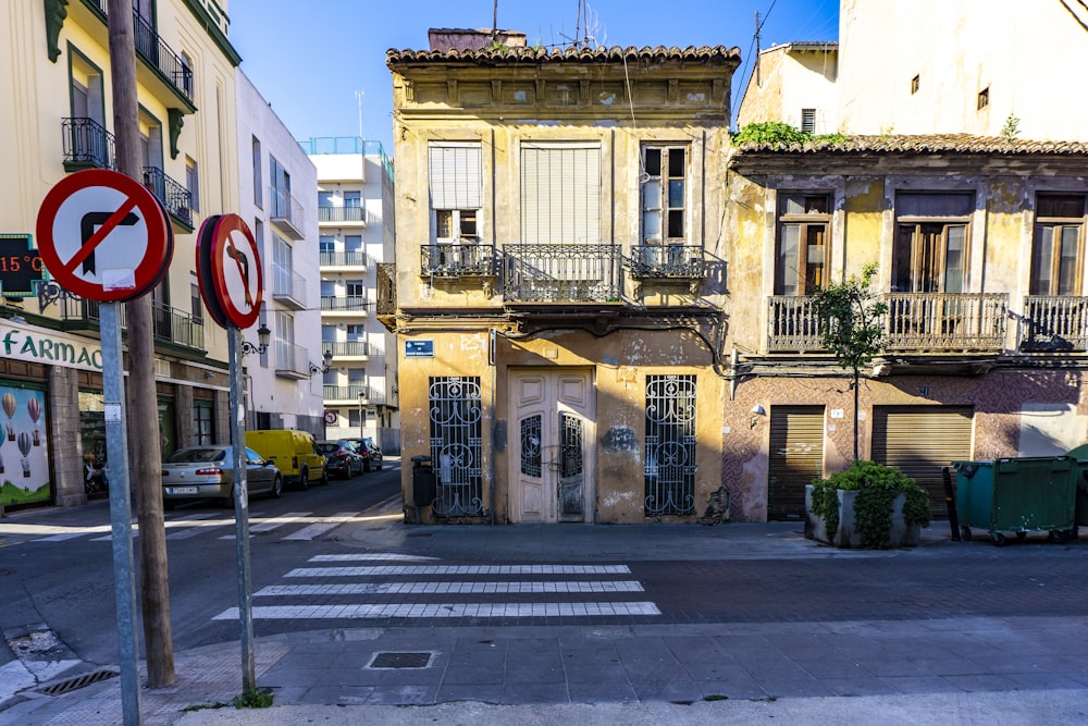 two no left and right turns road signage beside brown building