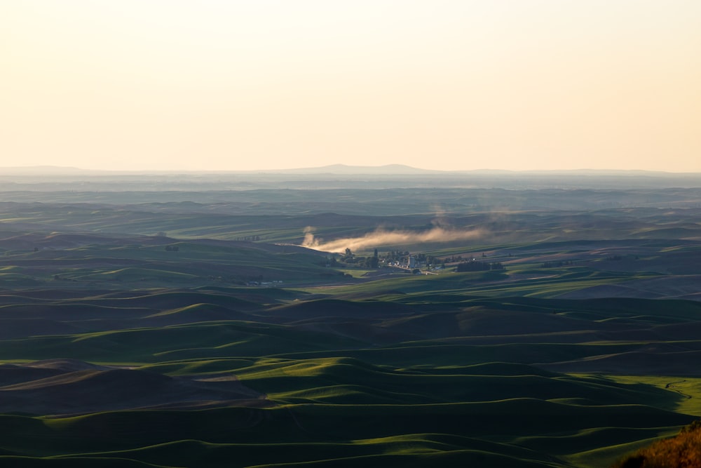 mountain range under white sky painting