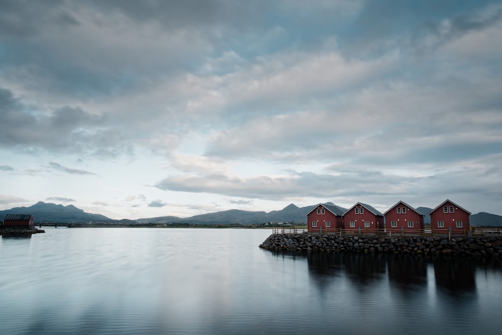 four red houses on the water