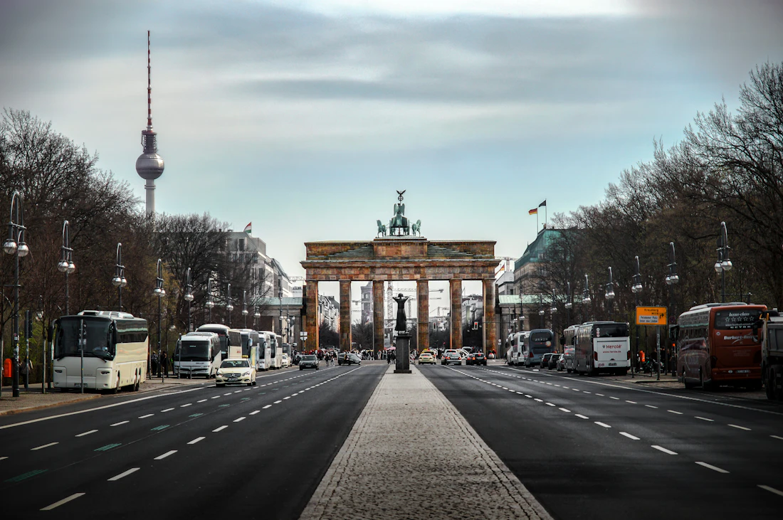 Cyclists passing Berlin architecture