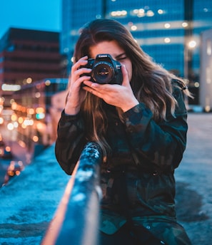 woman using camera