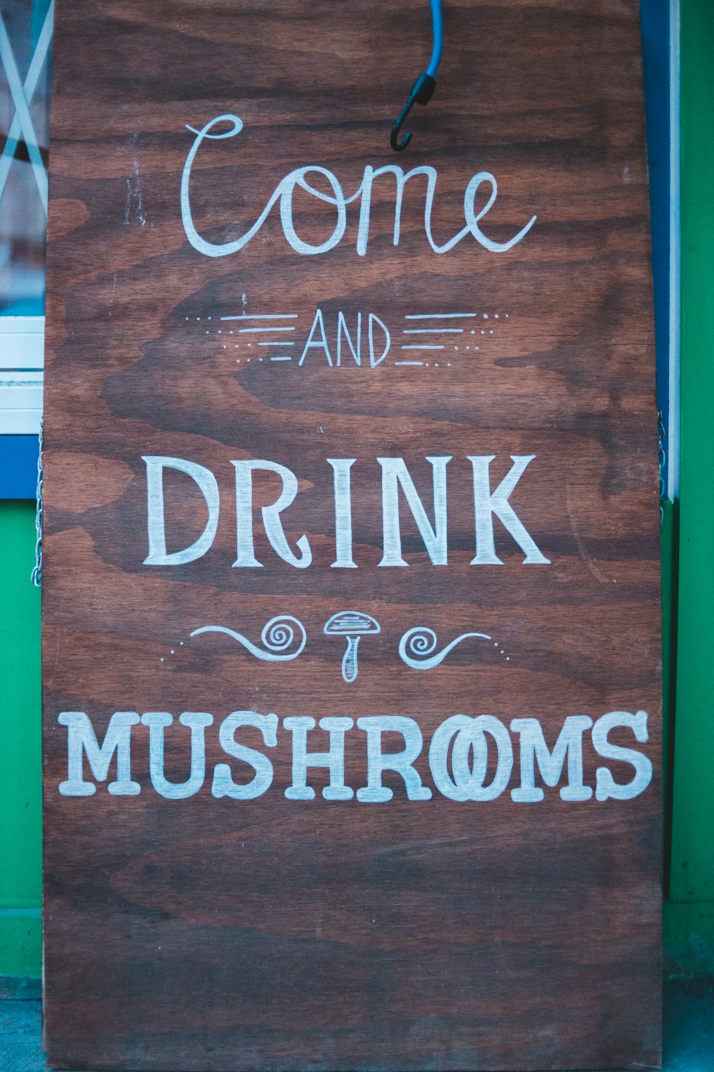 come and drink mushrooms sign