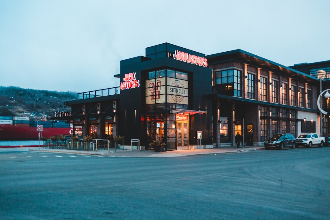 vehicle park near black building