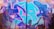 Vibrant street art covers a brick wall with intertwining letters and shapes in shades of blue and purple. Silhouettes of people with raised arms overlay the graffiti, suggesting a lively, energetic atmosphere.