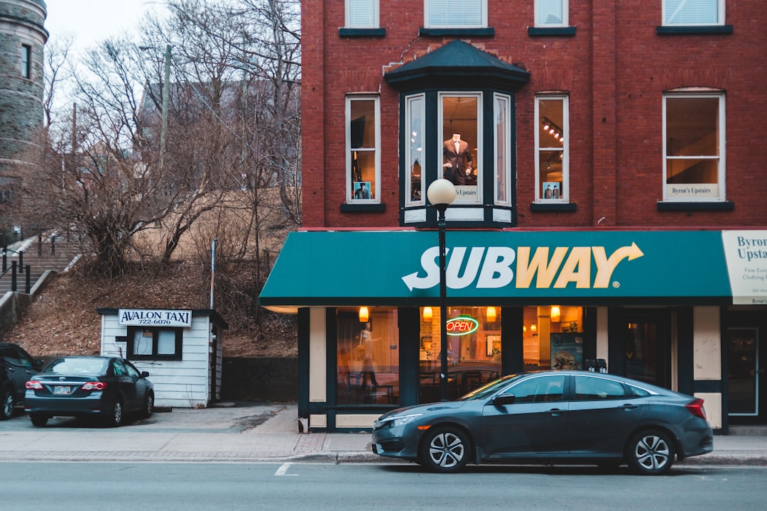 car in front of Subway store