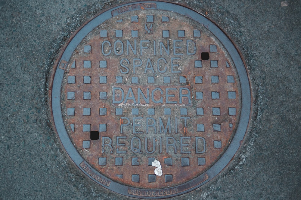 a manhole cover with words on it