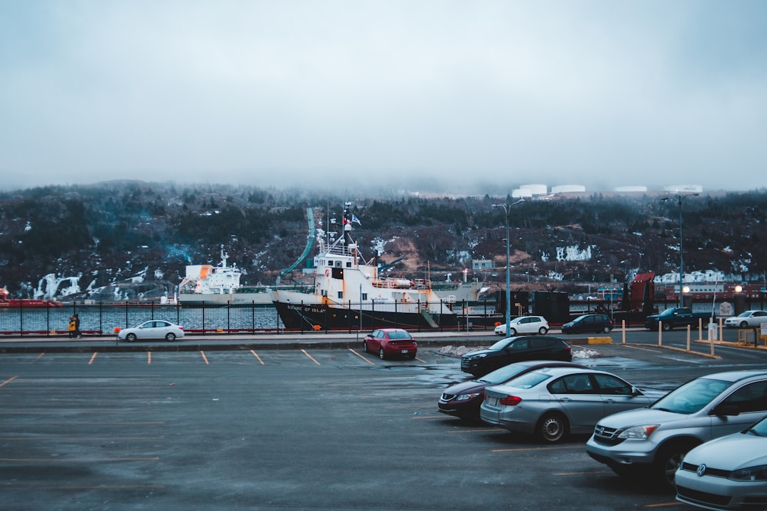 silver vehicles on parking lot during daytime