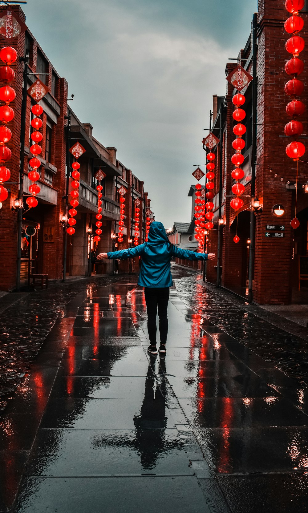 woman standing at middle of road