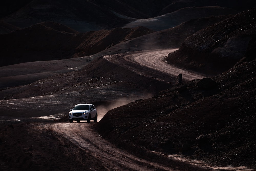 white SUV on road