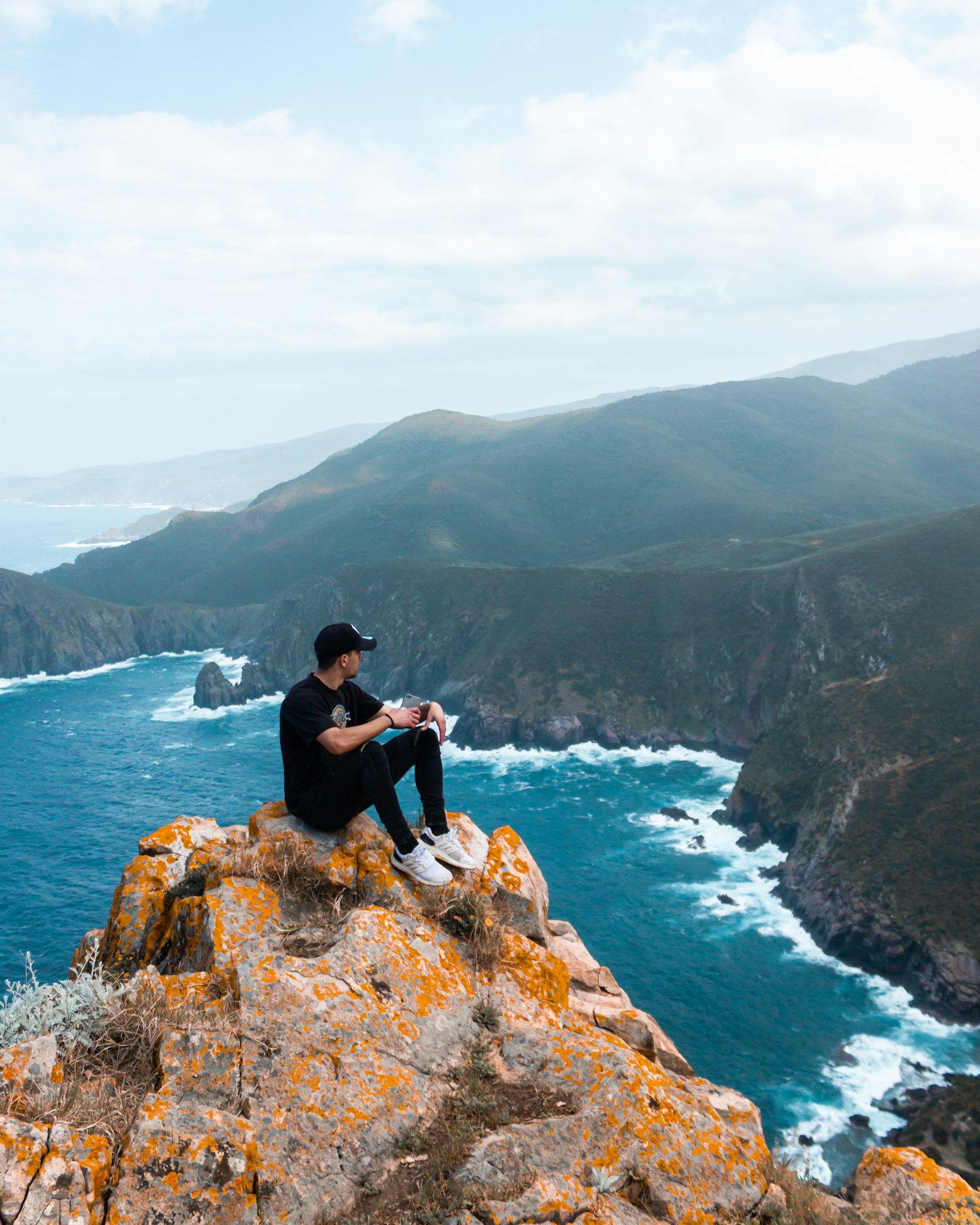 Canon EOS 7D + Canon EF-S 18-55mm F3.5-5.6 IS sample photo. Man sitting atop of photography