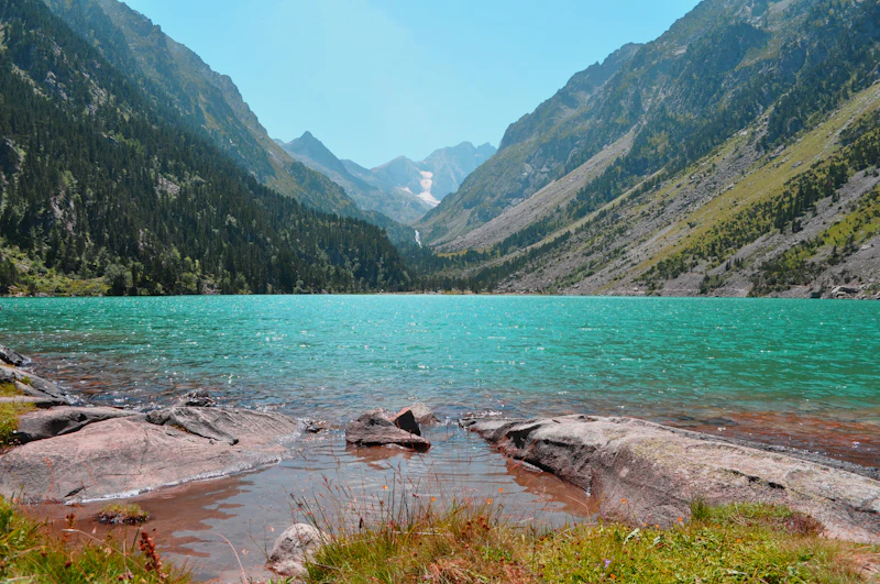 Alpine lake among Pyrenees peaks on the Carros de Foc route