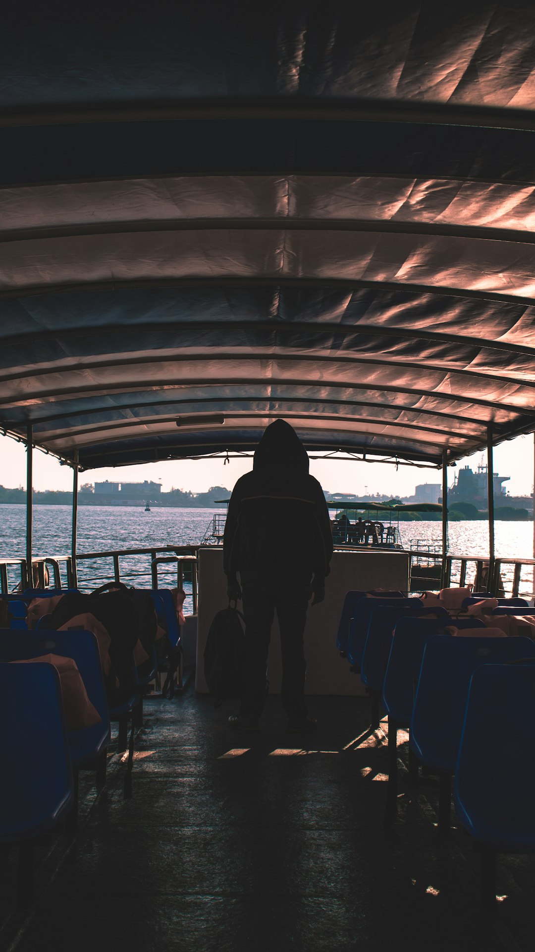 person standing inside watercraft