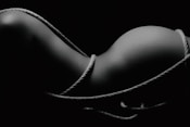 grayscale photography of naked woman covered with rope