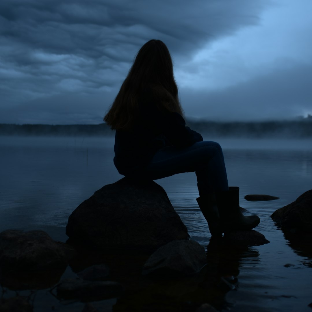 person siting on rock