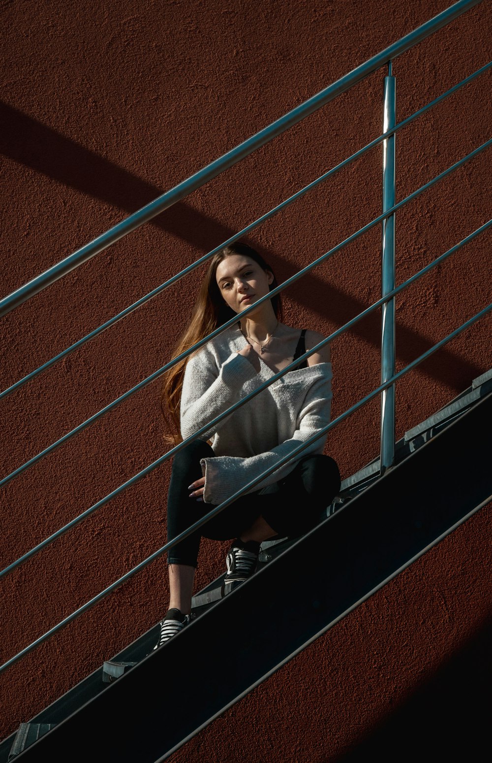 woman sitting on stairs