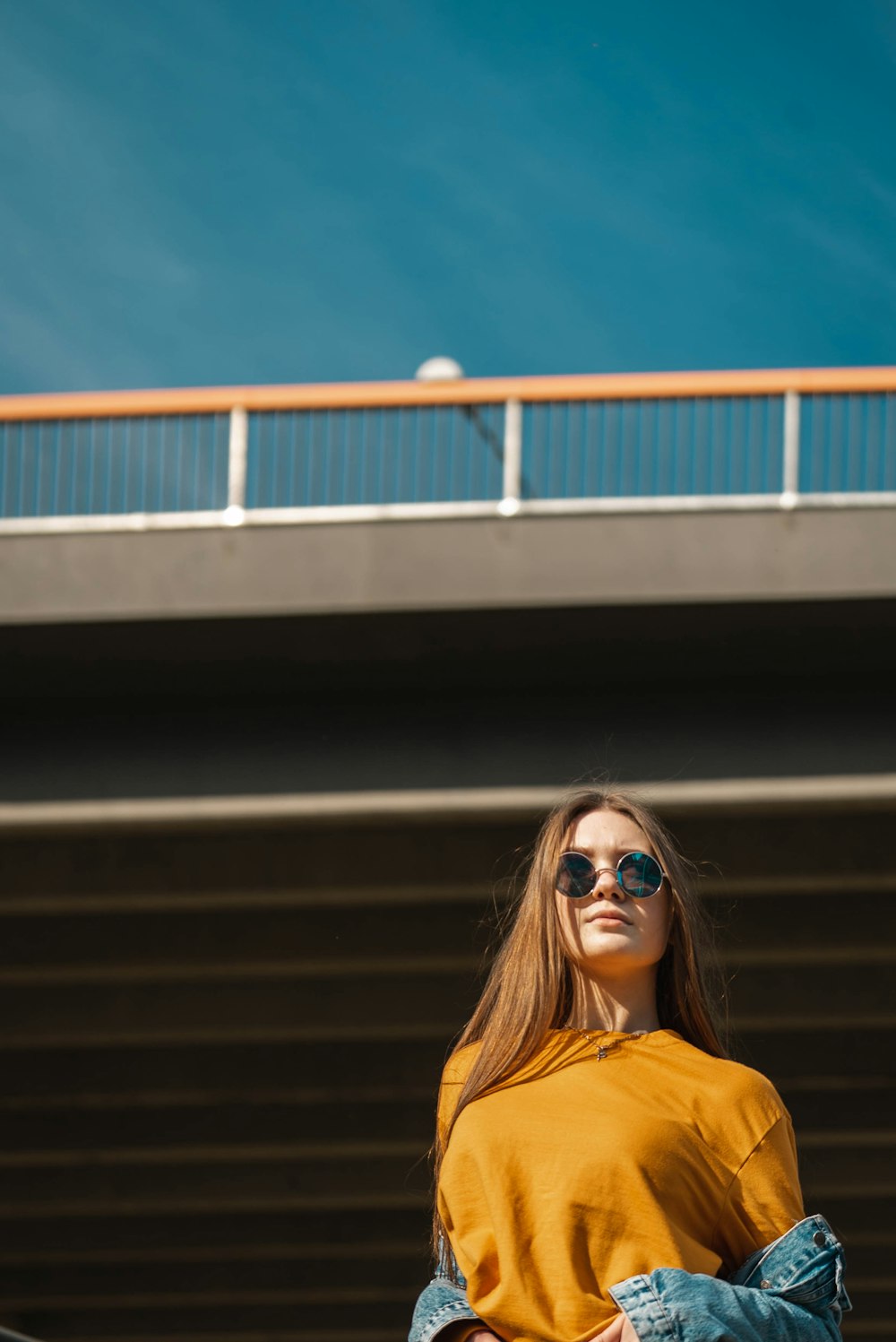 woman standing near building