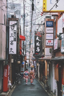 two women walking on street