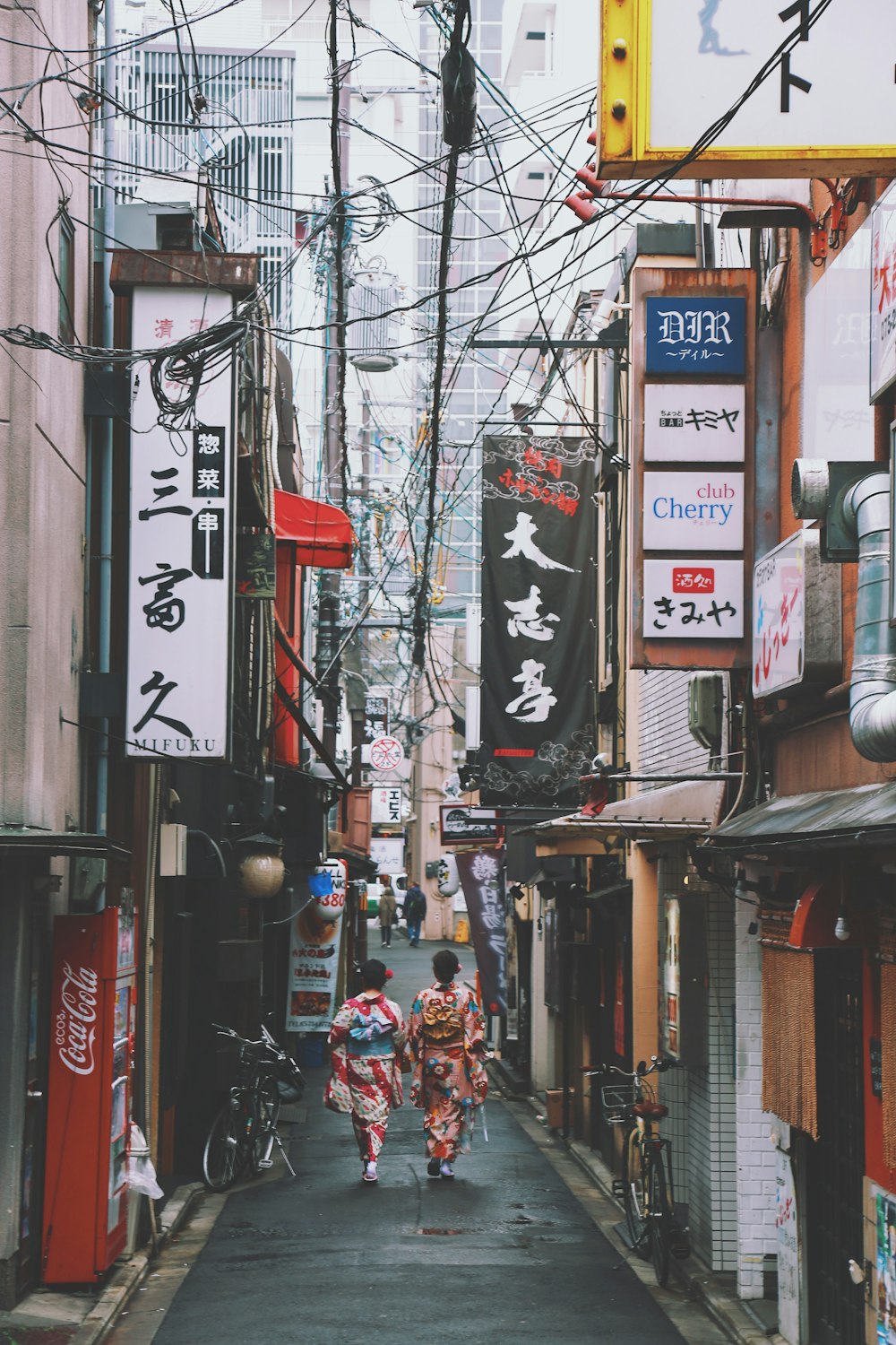 two women walking on street