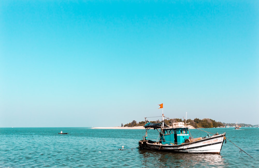 gray boat on body of water