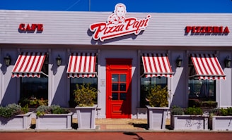 white and red Pizza Papi house with closed door