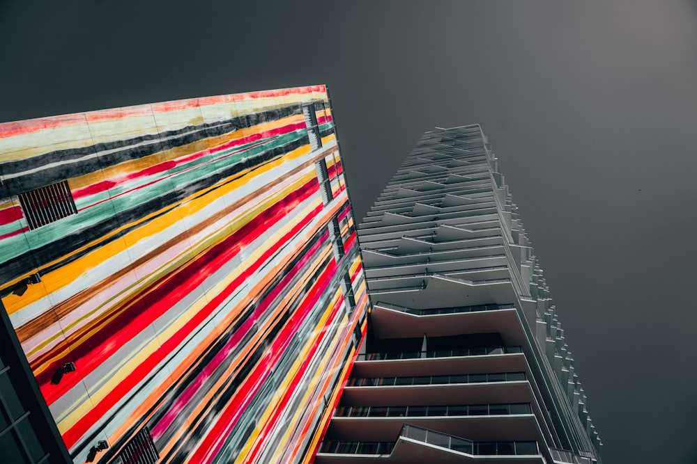 low angle photography of gray high-rise building