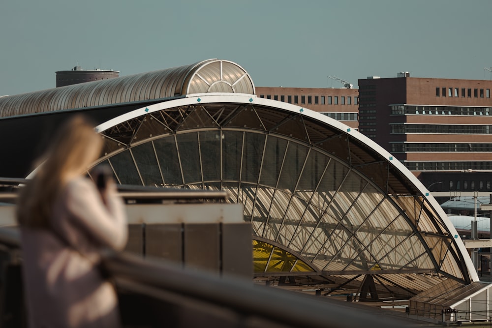 woman standing near building