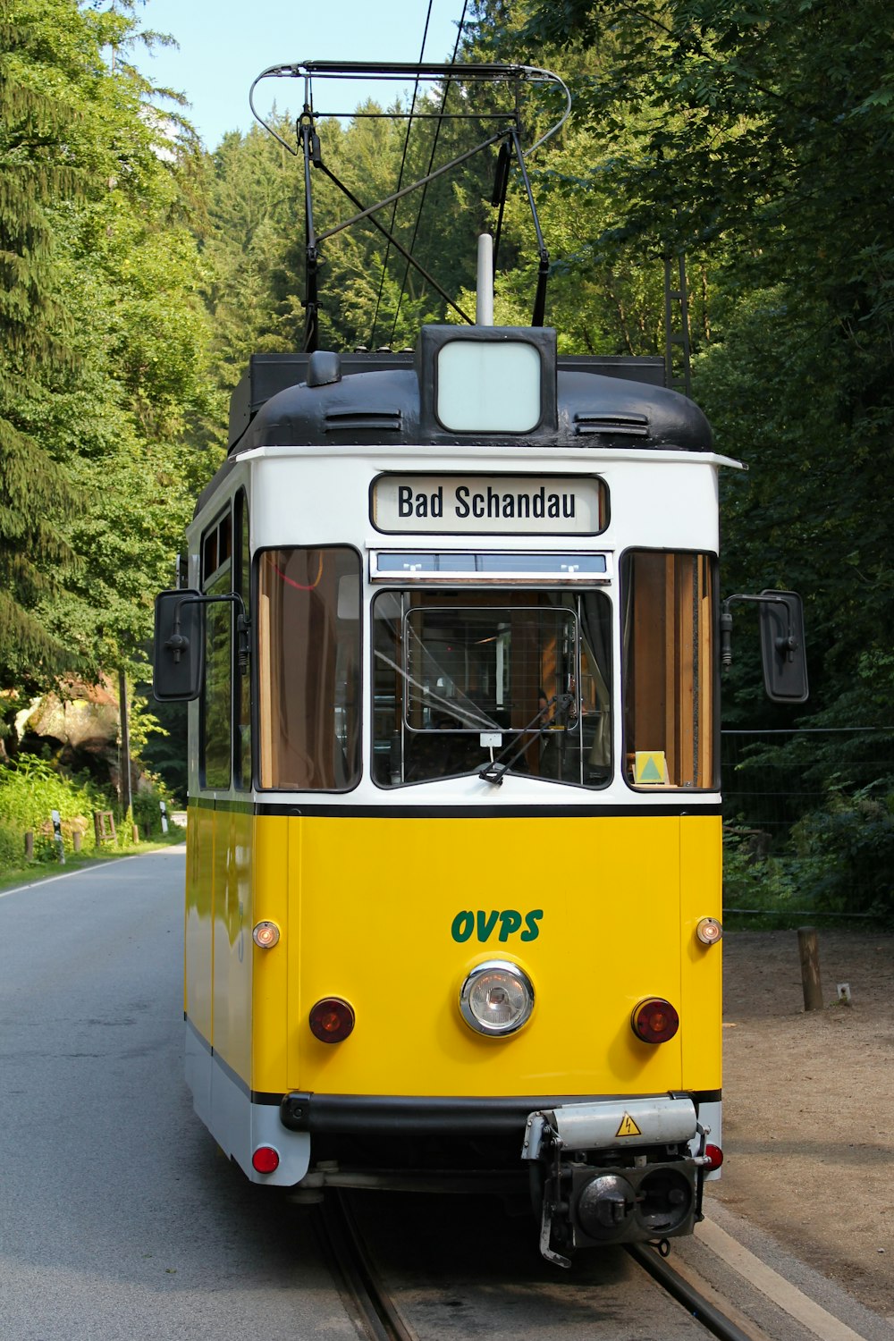 yellow tram on road