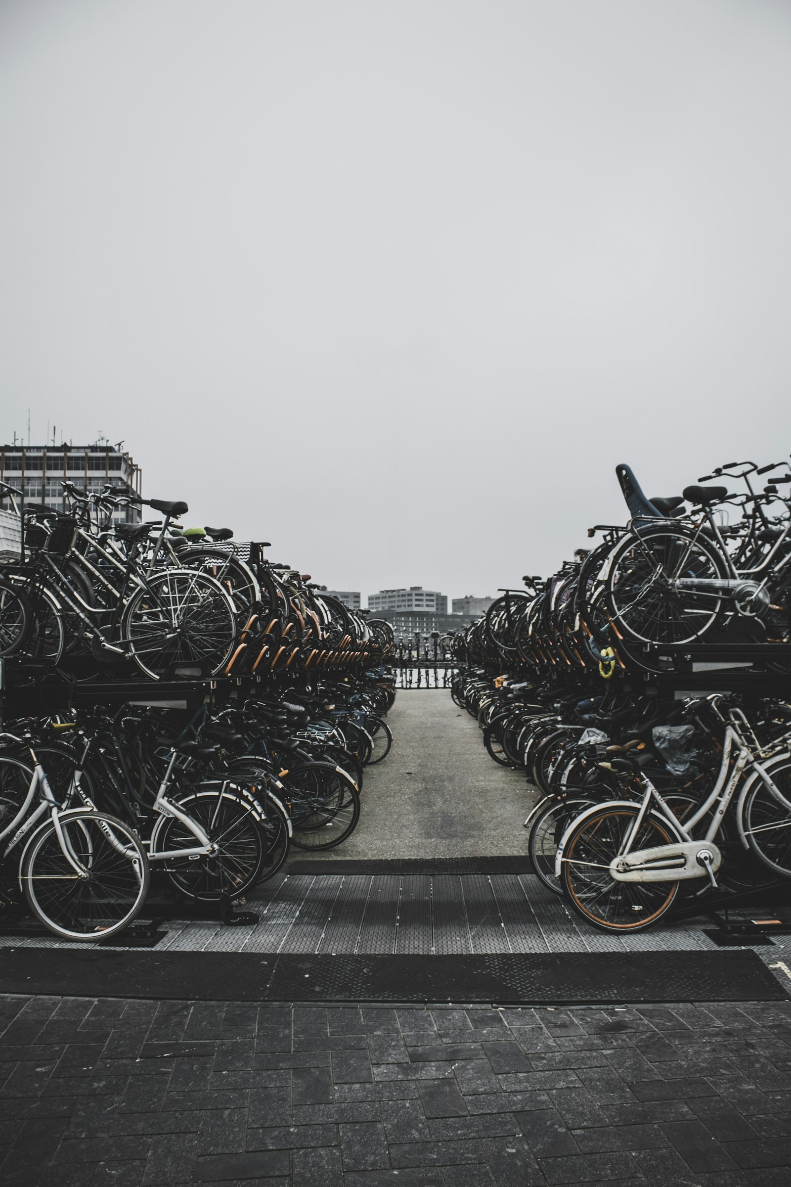 Canon EOS 80D + Canon EF-S 18-55mm F3.5-5.6 IS II sample photo. Pile of bicycles outside photography