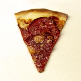 An appetizing slice of pepperoni pizza with golden crust and rich tomato sauce.