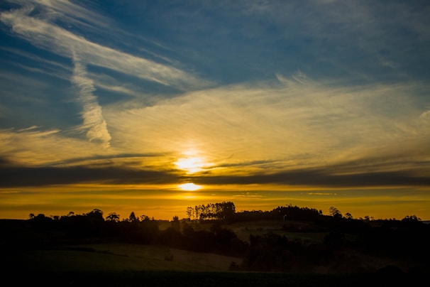 Album cover featuring a serene landscape at sunset