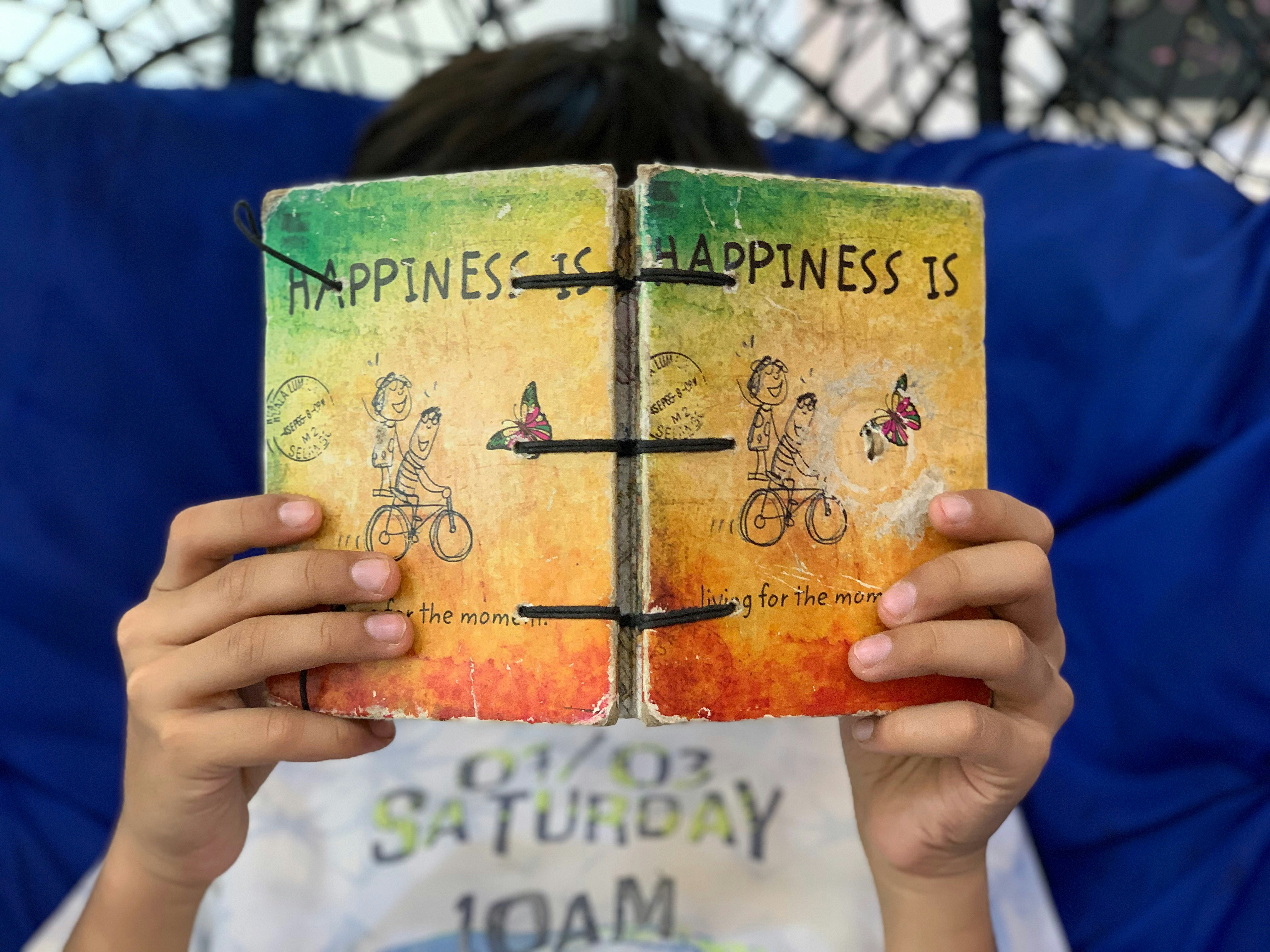 Child reading happiness book