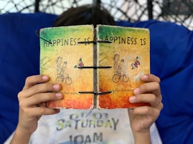 person reading happiness book