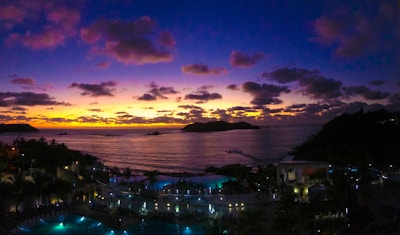 A stunning sunset over a luxury beach resort.