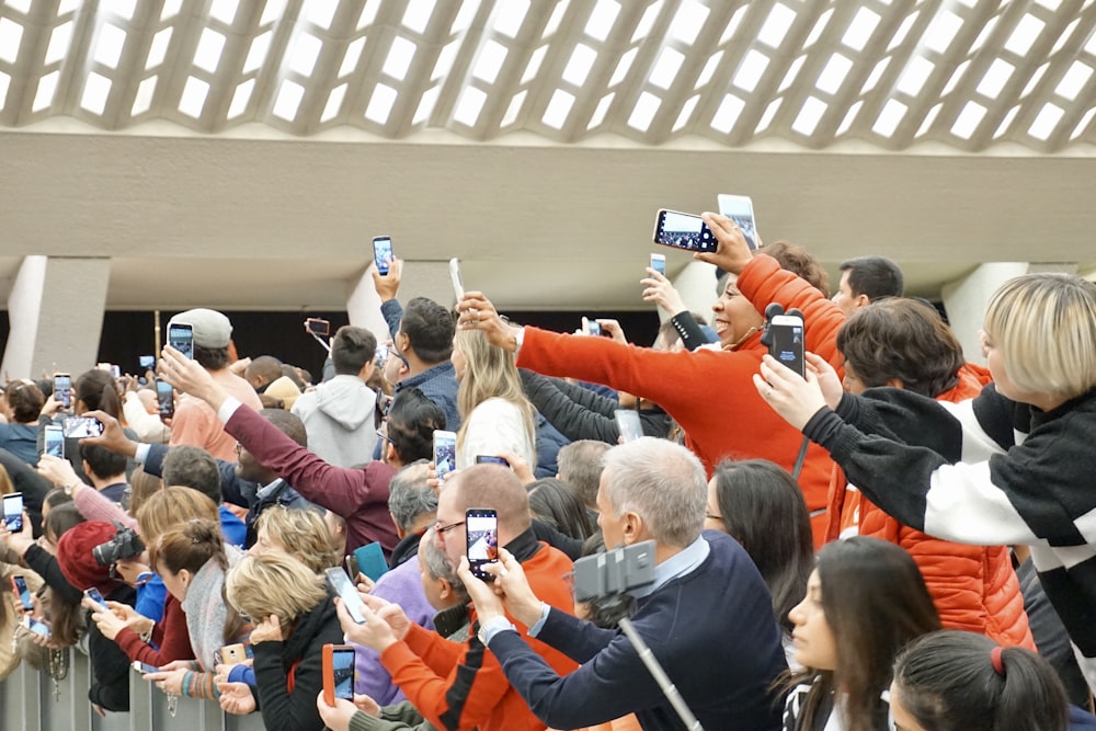 people taking photo using Android smartphones