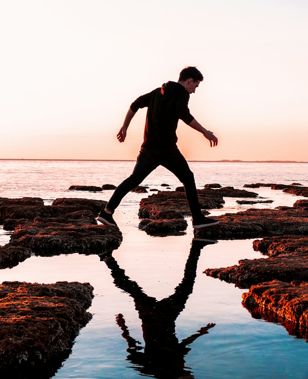 man walking on shore