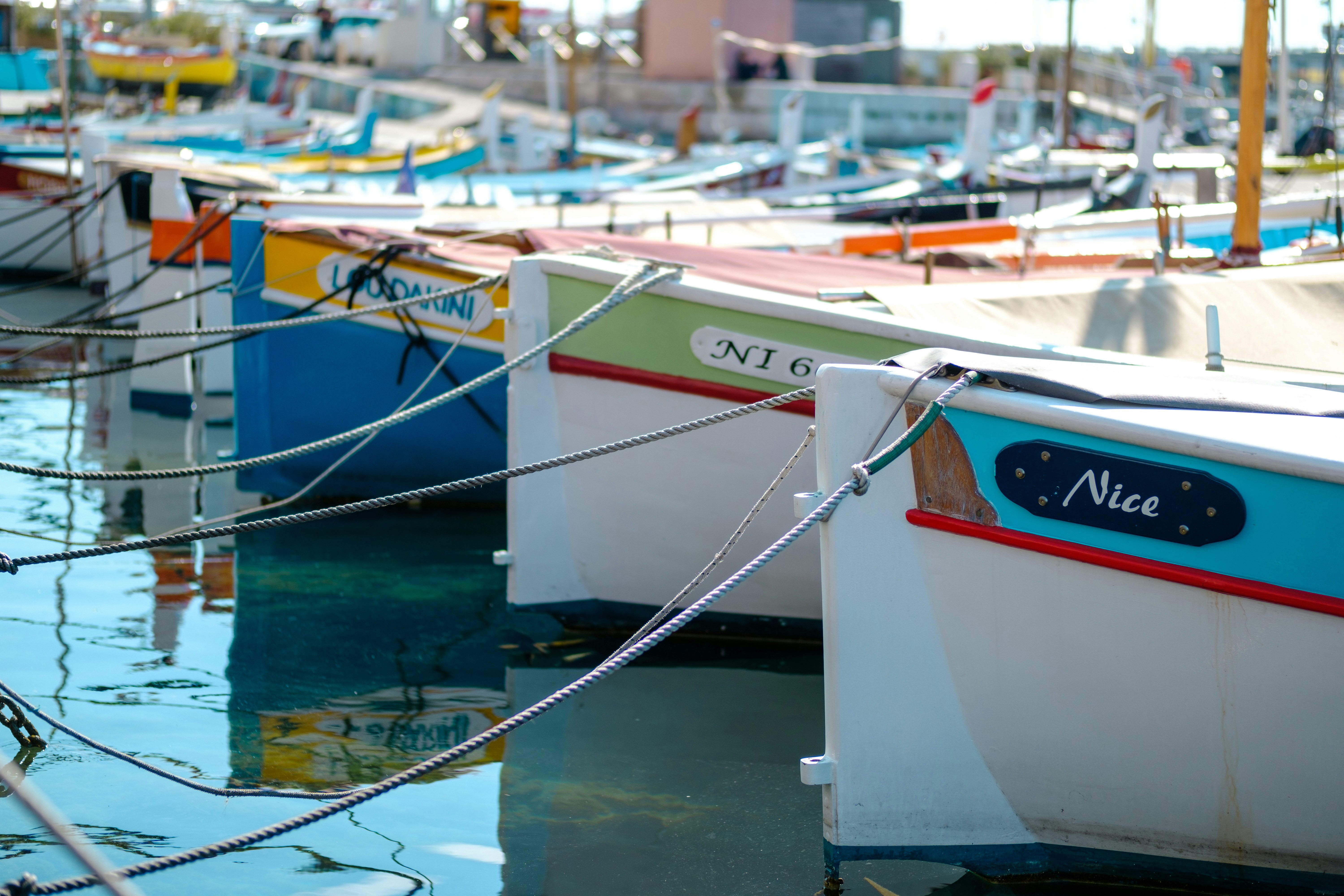 boats on dock during daytime