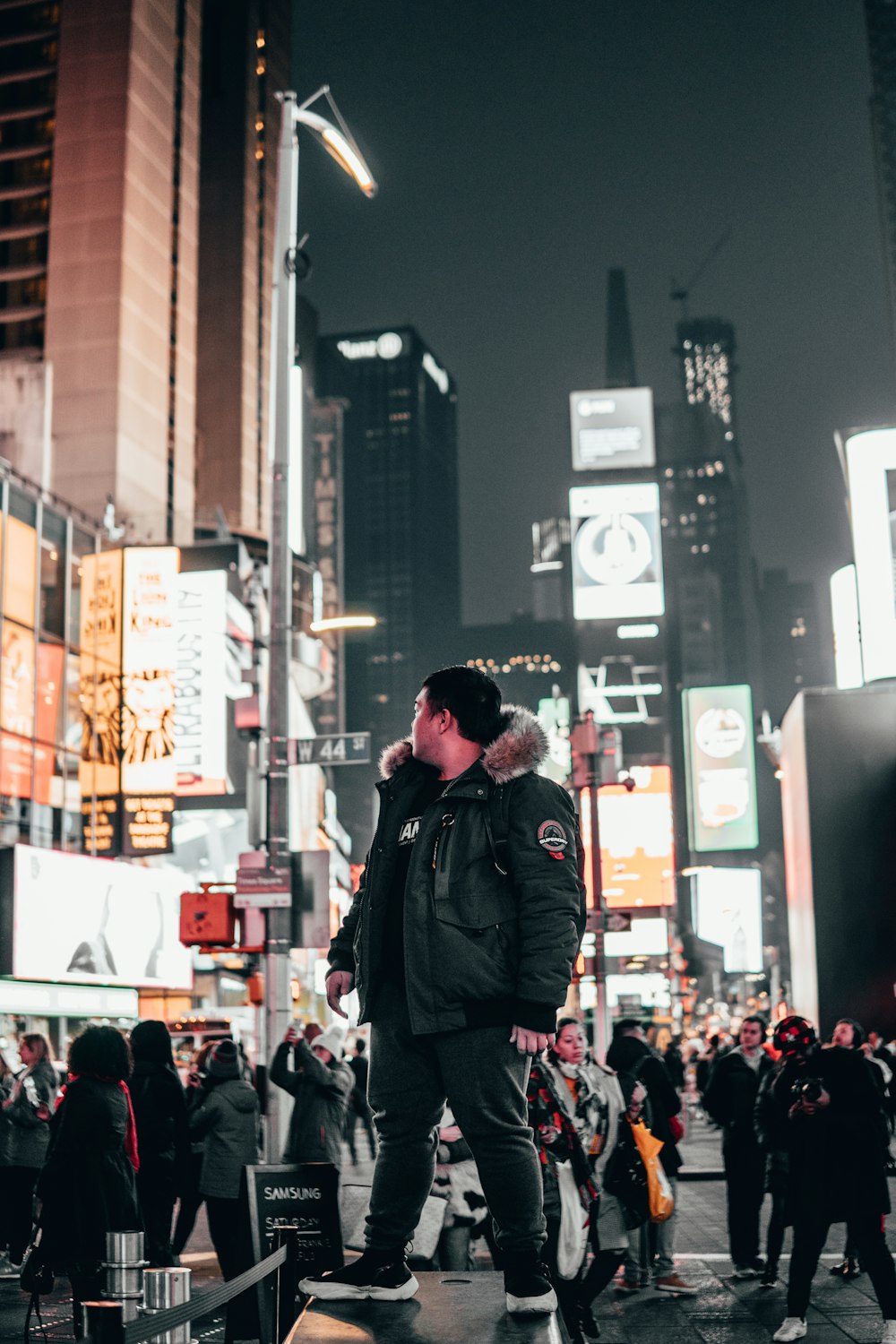 man looking at building