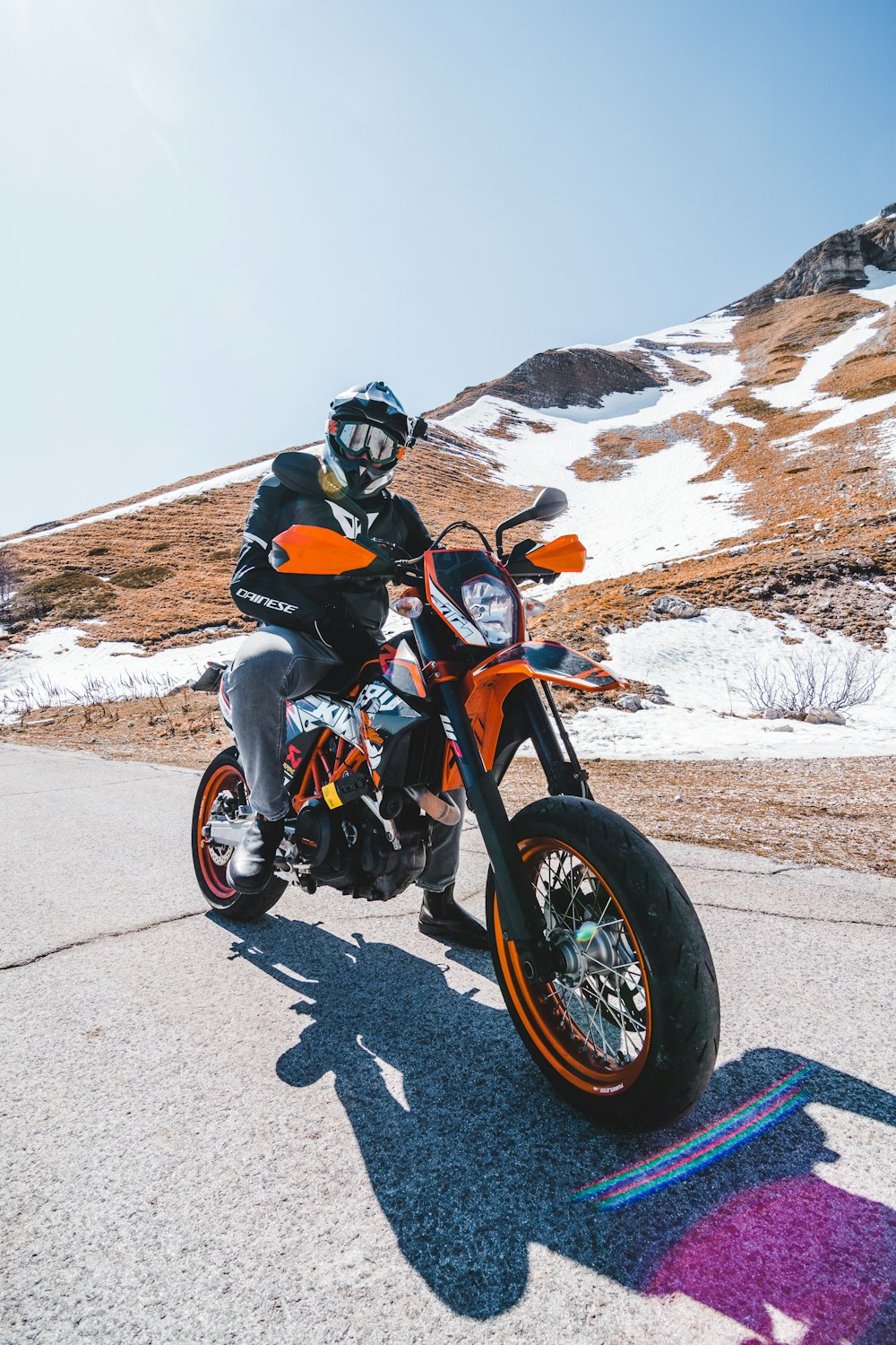 person in black jacket riding on motorcycle