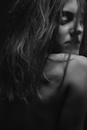 long haired woman facing back