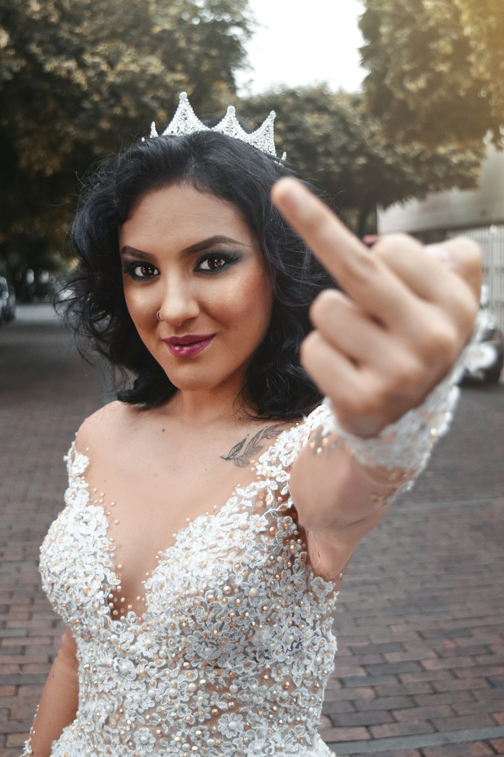 woman raising left middle finger