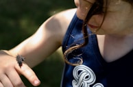 Young learners observing a ladybug on a leaf, curiosity shining in their eyes.
