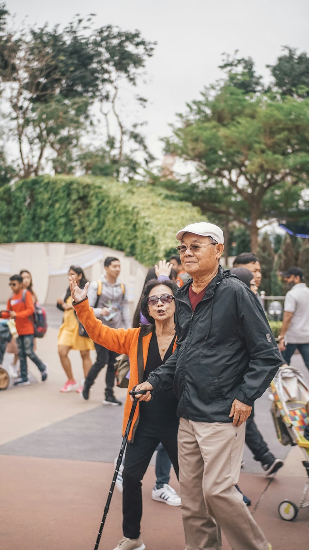 man walking with woman near trees