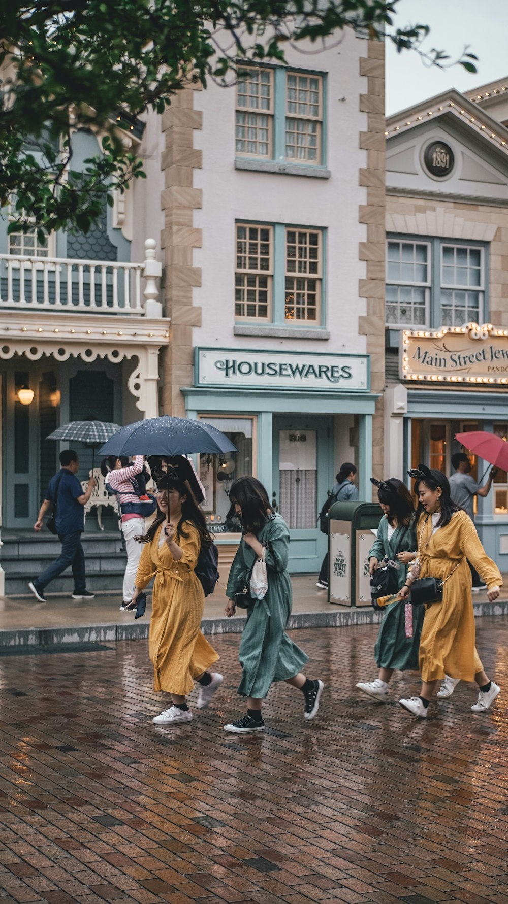 woman walking near gray building