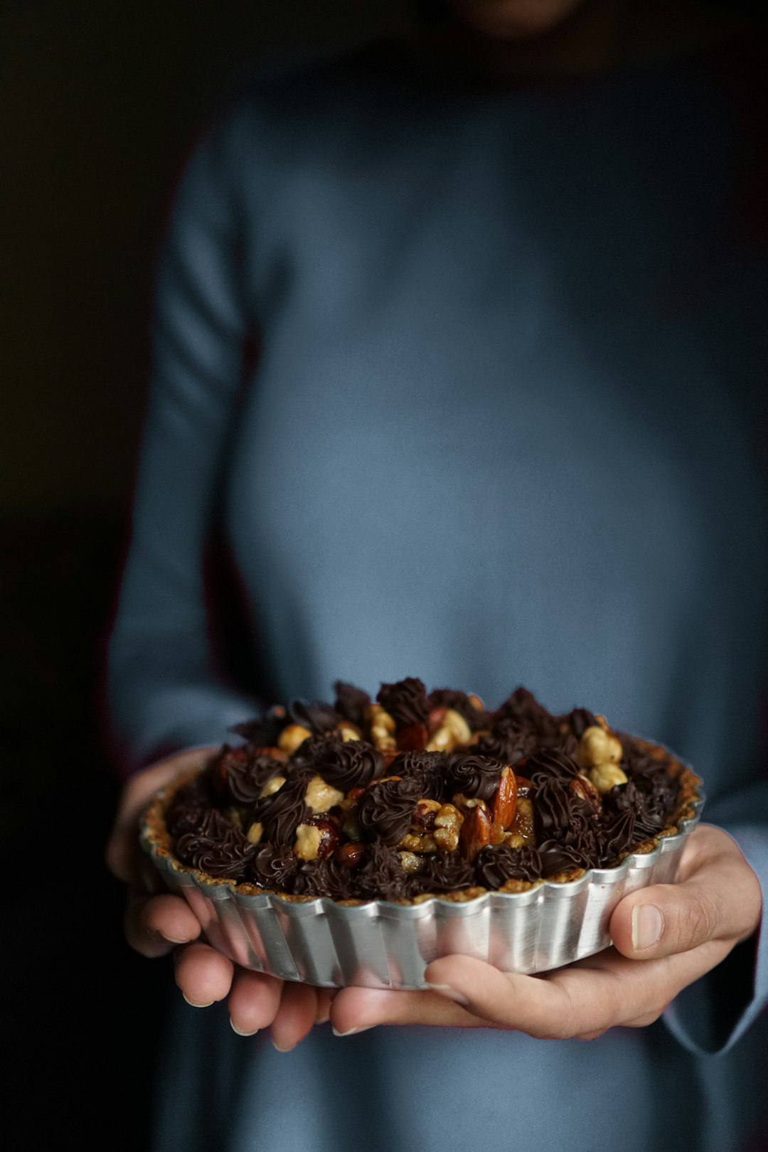 person holding baked pie