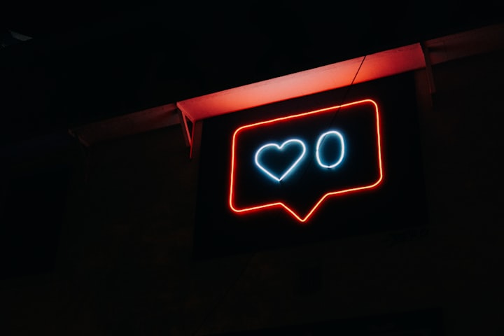 a neon sigh with the shape of a social media like button, a heart with zero next to it 